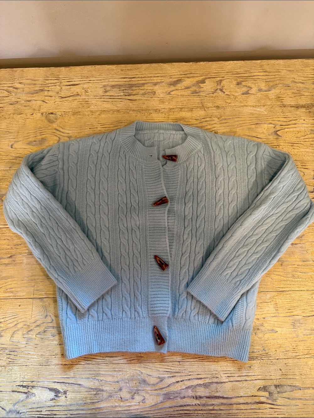 Light Blue Cable Knit Women’s Cardigan Sweater with horn like bottoms